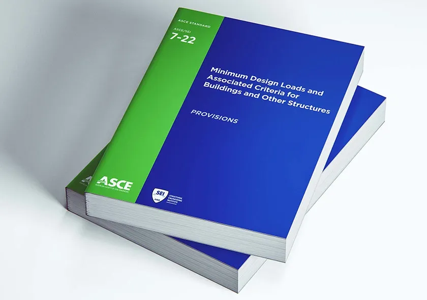 Stack of AEC code reference books including ASCE and IBC